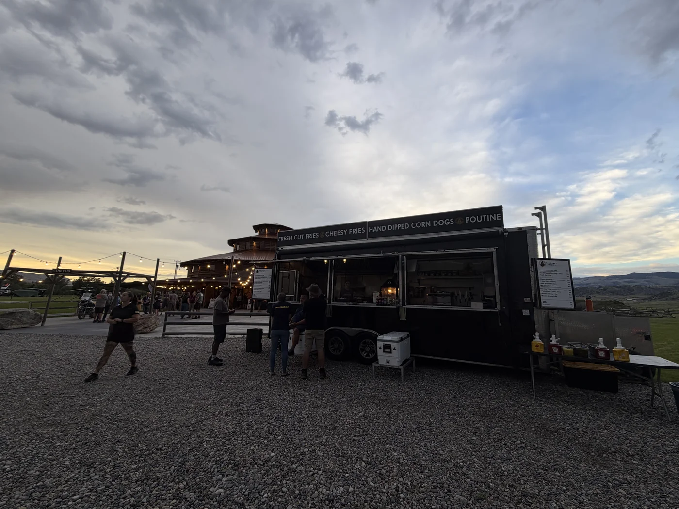 The Gravy Train parked in front of the ranch lodge at sunset at The Big Thing