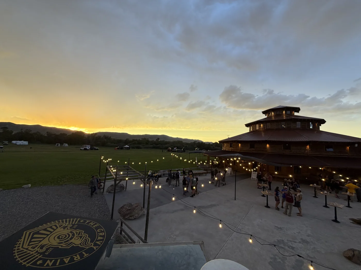 XOverland Ranch lodge lit up at dusk during The Big Thing overland gathering