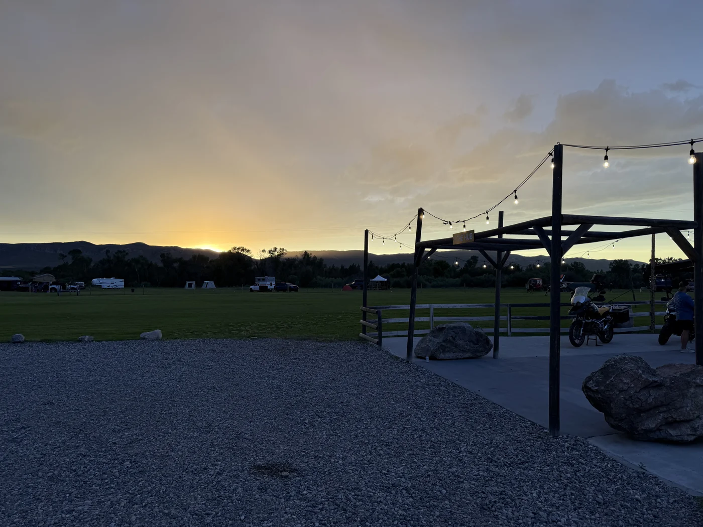 Overland campsite at sunset with string lights at XOverland Ranch during The Big Thing