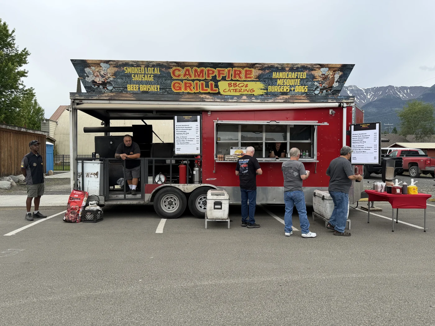 Campfire Grill serving customers with a mountain backdrop at Mountain High Broncs & Bulls