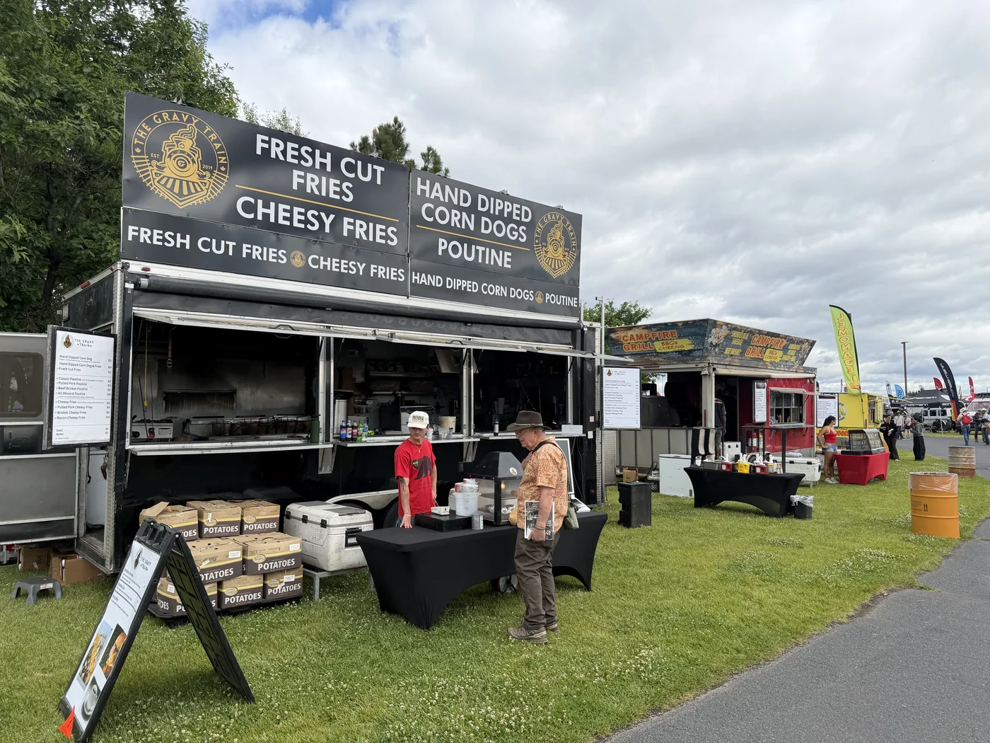 The Gravy Train and Campfire Grill lined up side by side at Overland Expo PNW