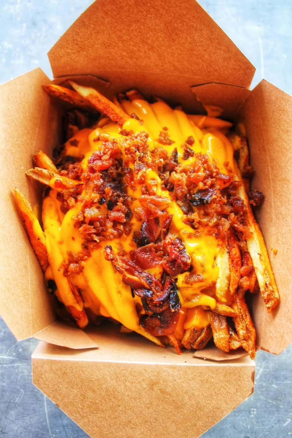 Cheese fries topped with crispy bacon