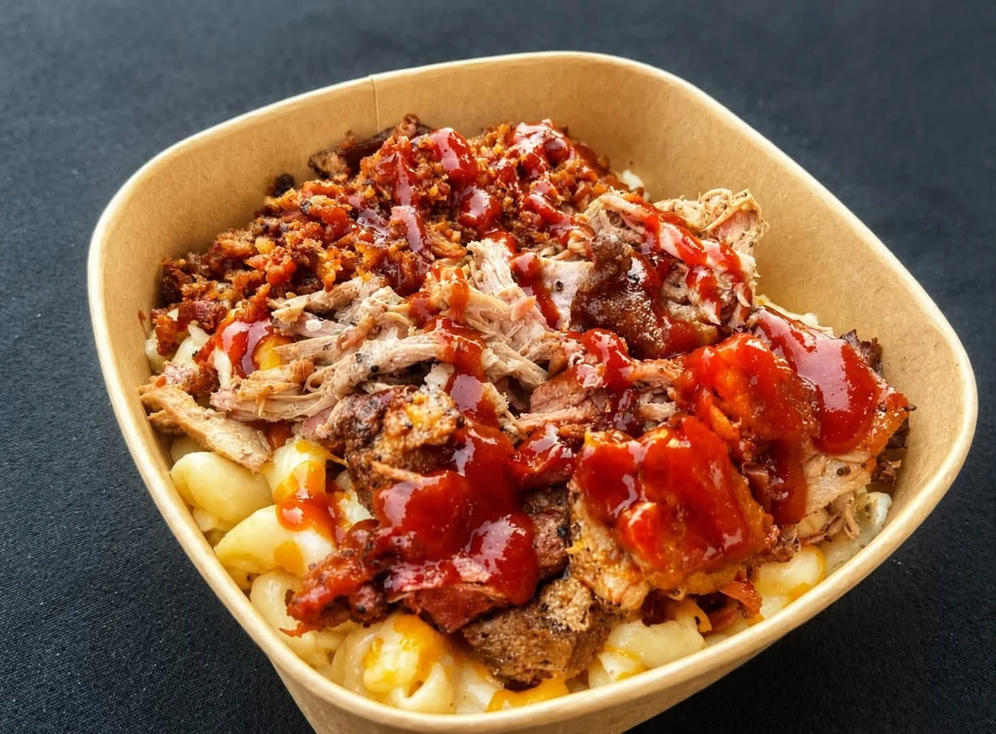 Mac and cheese loaded with pulled pork, bacon and BBQ sauce