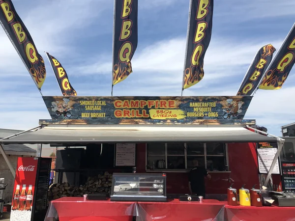 Campfire Grill truck with American flags at an outdoor event